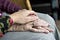 a young hand holding a elder hands