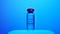 A vial of vaccine sitting in front of a blue background