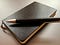 A paper notebook and a pen