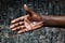 Large hand image with white cable coming out from the wrist — merged with the flesh