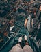A man looking at the city from a high building