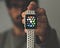 Apple watch in human hand for recording health vitals