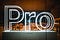 Larger neon letters in a store display spell out “pro.”