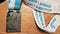 A rectangular medal showing a relief of Pike O’Stickle on a blue and white 2020 Langdale Half Marathon ribbon.