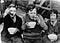 Three children eating in 1930s Britain