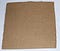 A square of cardboard with shallow slits cut every 1/4" on opposite edges to create a simple cardboard loom