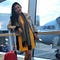 Karen loves to fly around the world as evidenced by this picture of her at the airport.