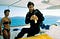 Still image from the movie The Living Daylights, where Bond meets a bikini-clad woman.