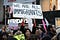 Photo of woman holding sign reading “We are all immigrants” at the Women’s March in New York, NY, January 22nd, 2017.