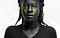 Grayscale photography of a black woman with yellow tears.