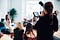 Person shooting a video of a group talking.