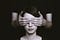 One persom covering another persons eyes