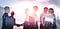 business people shaking hand in singn of partnership while outsoucing talent to other contries