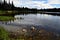 Landscape photo of a lake with trees in background