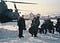 A photo of the author next to a helicopter in Bosnia.