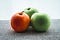 One red apple and two green apples. Apples are a traditional food for Rosh Hashanah, the Jewish new year holiday.