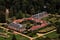 Aerial photo of Schloss Wolfsgarten, showing manicured gardens surrounding the palace quadrangle.