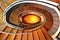 Downward view of a large spiral staircase