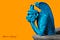 Contemplative gargoyle at Notre Dame, colored blue against an orange background.
