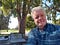 Don Simkovich sitting on golf course coffee shop patio.