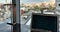Picture of my computer with the HTML code for my distill.pub publication. Background is a window showing Tokyo, Japan.