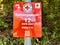 A German Red Cross sign along a hiking trail displaying a QR code.
