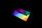 A laptop with rainbow colors highlighting it.