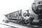 Steam locomotive pushing a flatcar with turntable on top