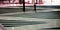 Person walking down ramp that criss crosses a staircase