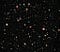 A picture from the Hubble Telescope showing tens of thousands of galaxies.