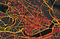 Map of a street network of Cambridge, largely covered in red and orange dots, with a small area of green and yellow outside.