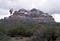 A large snowy cliff hangs over the Oak Flat campground.