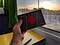 Michael holding up an Android TV box while taking a train back from Porto to Lisbon