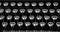 closeup of vintage typewriter keys in black and white photo