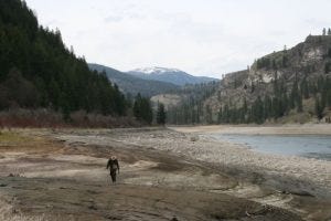 Man walking next to the Columbia River