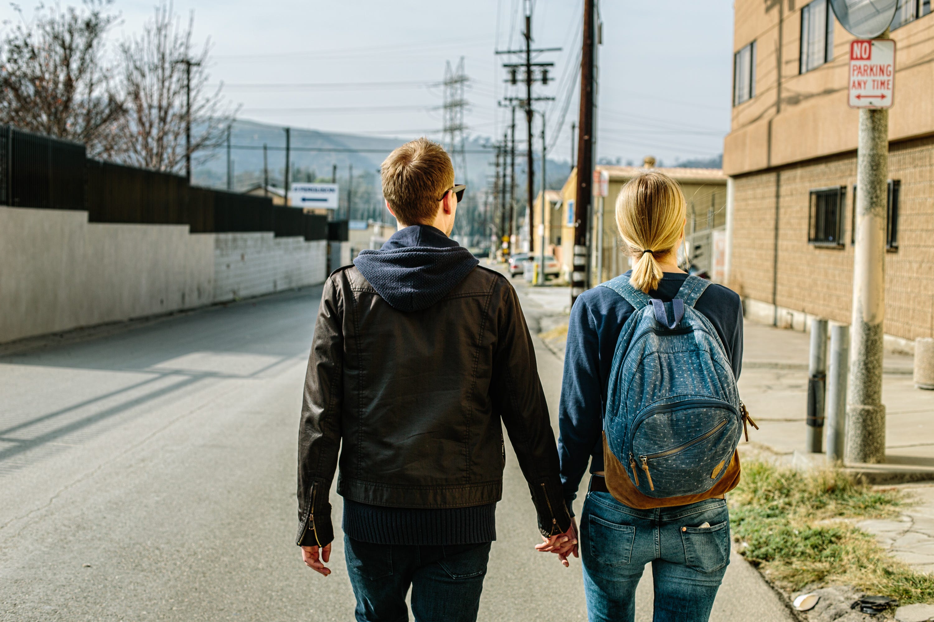 A couple walks the streets facing millennial homelessness.