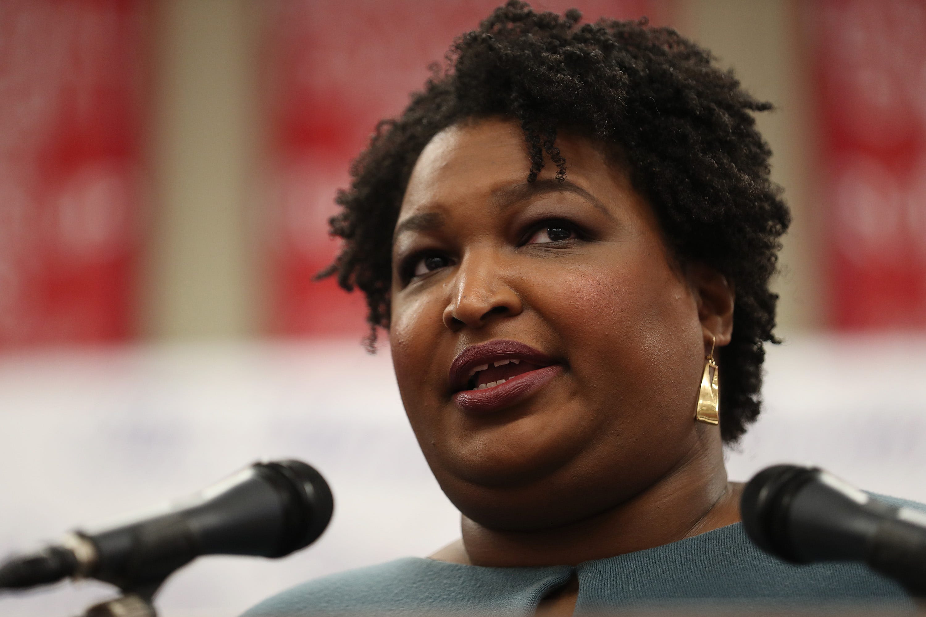 A closeup photo of Stacey Abrams speaking at an event.