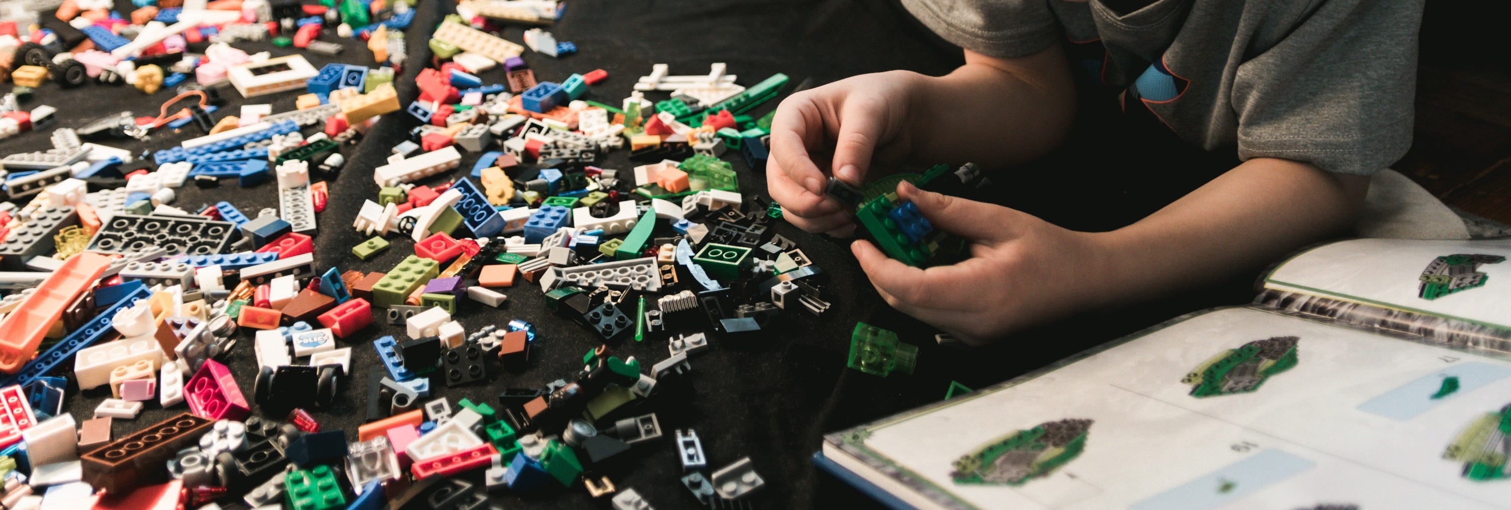Boy building blocks of legos — a play on the esbuild bundler