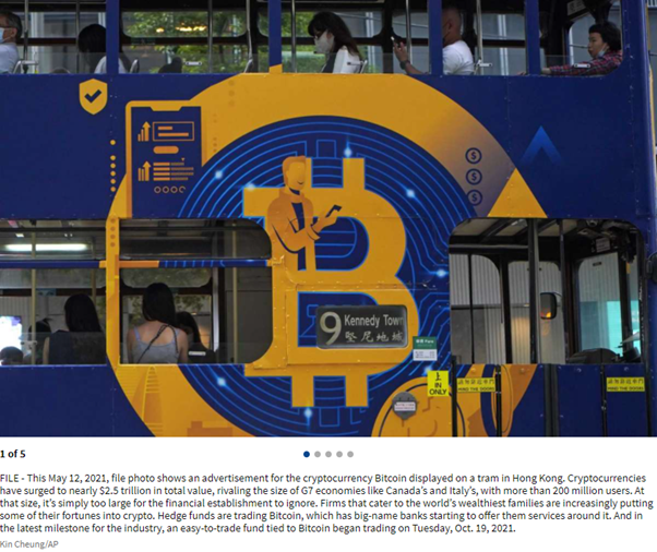 Photograph of a tram in Hong Kong with a Bitcoin advert displayed on its side.