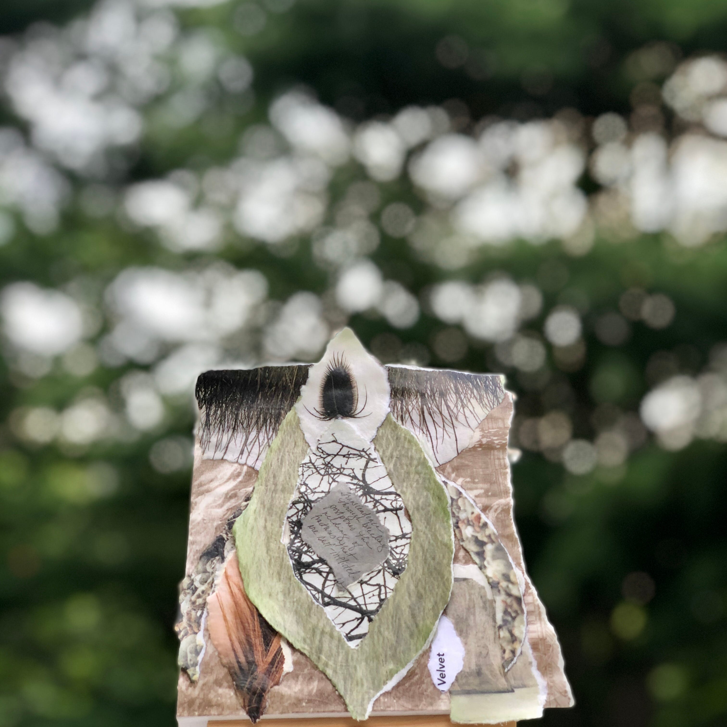 Abstract mixed media collage in the shape of a vulva.
