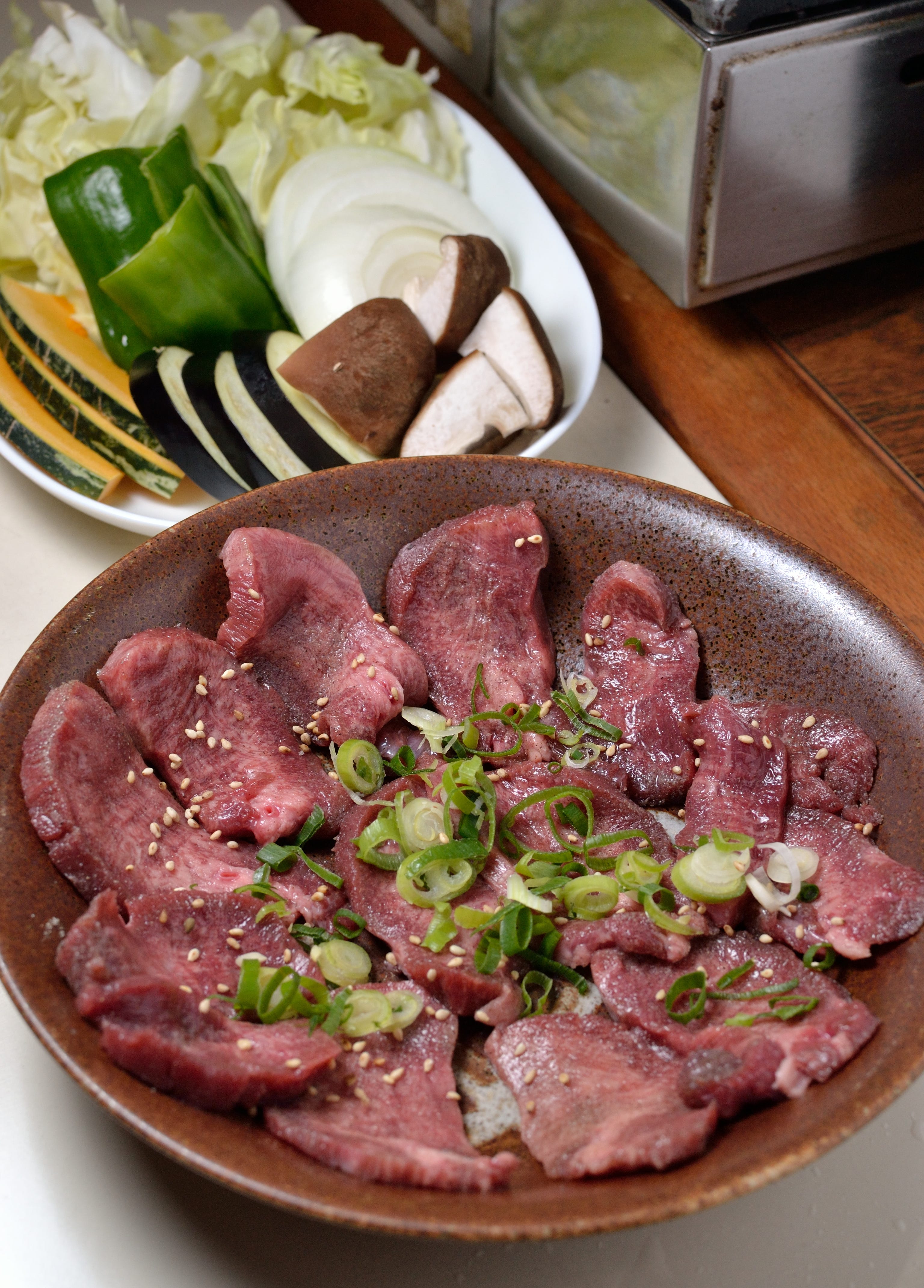 Tan-Yakiniku is BBQ beef tongue. “Yakiniku” literally means “to grill