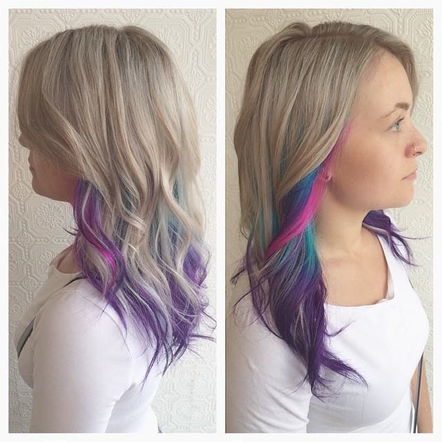 Blonde Layered Cut With Tousled Waves And Rainbow Highlights