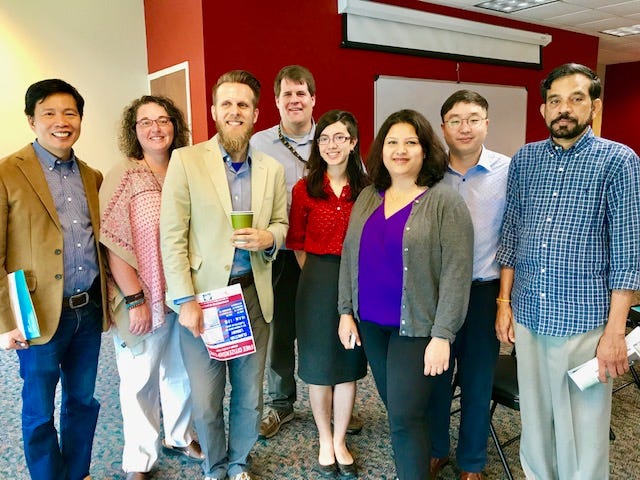 A photo of Clarkston Mayor Edward Terry with Atlanta ethnic media and CPACS staff members.