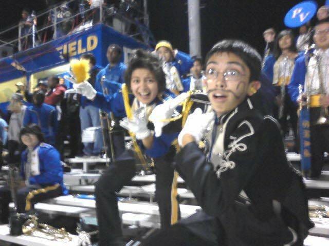 Erin posing in marching band in high school