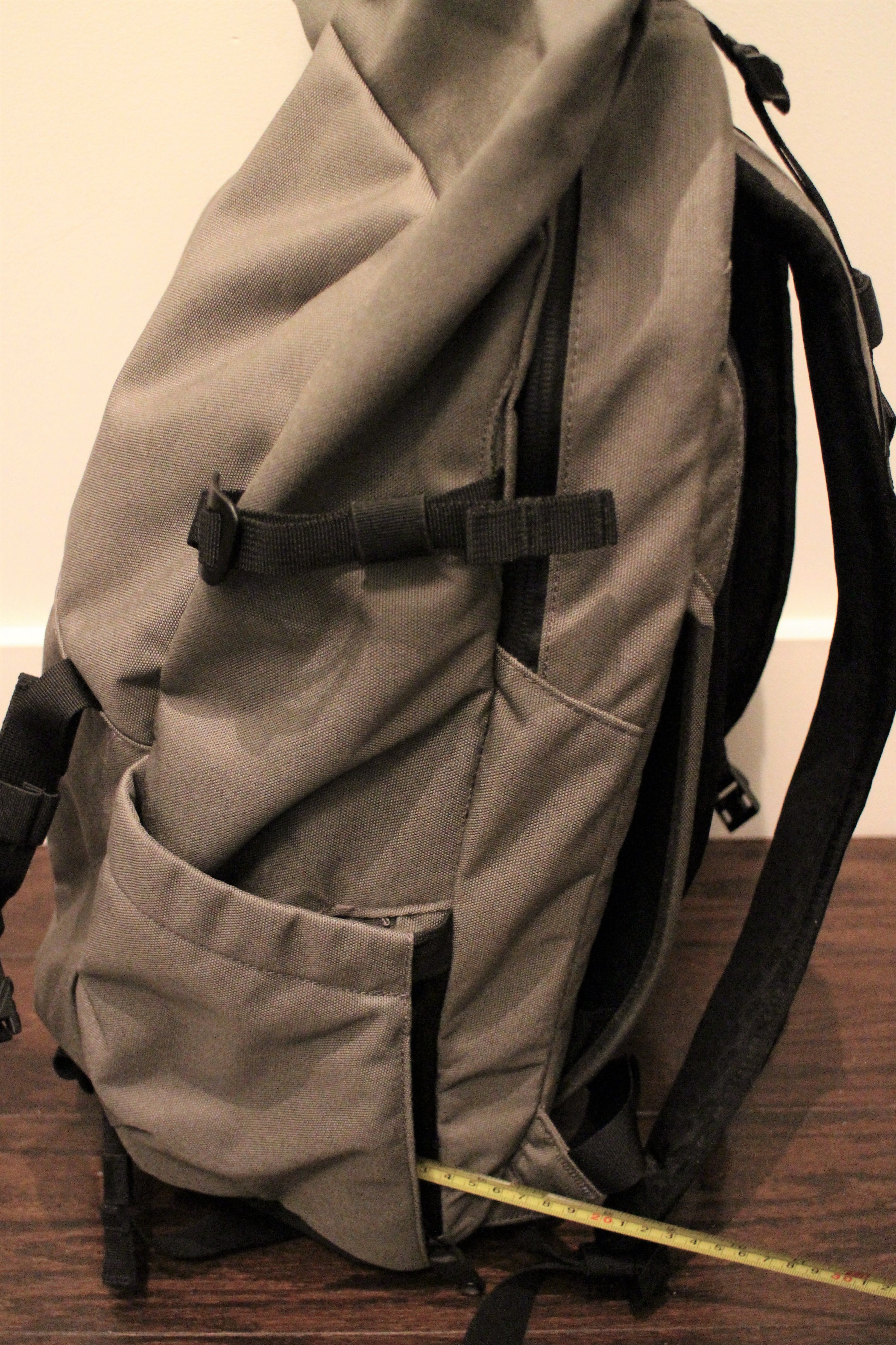 backpack with water bottle side holder