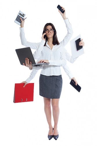 A picture of a woman doing too many things at once.