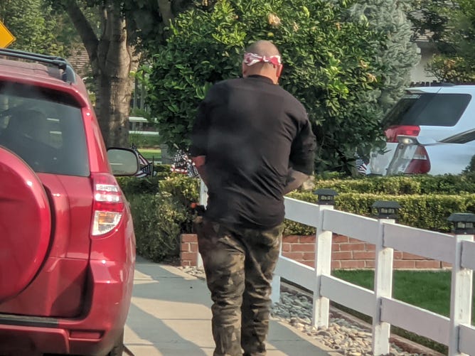 An attendee armed with something in his right pocket. Photo by Sabine Alexander.