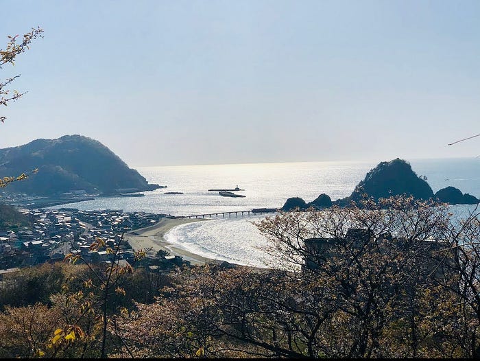 The sun shines over the port town of Yura with its characteristic Hakusan Island. Yura is a short drive from Mt. Kumanonagamine, one of the 100 Famous Mountains of Yamagata in Tohoku, north Japan.