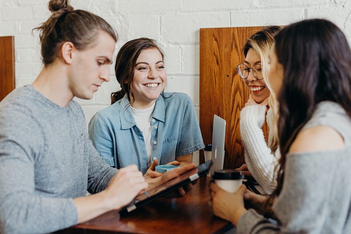 employees talking happily at the cafeteria