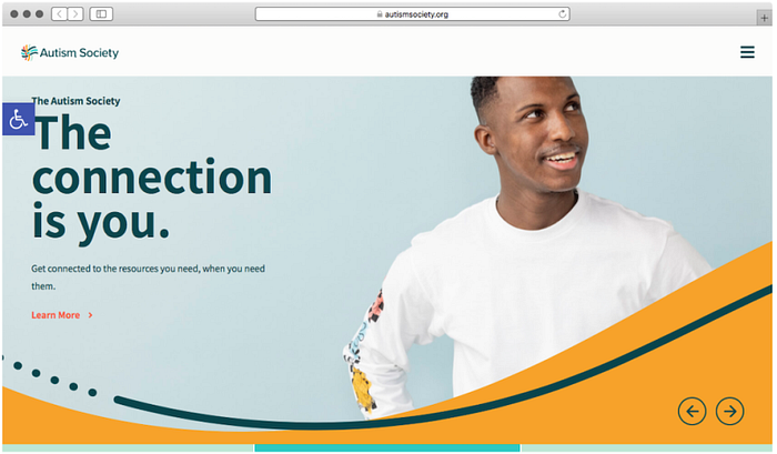 Screenshot of the website of Autism Society, showing a large picture of a happy-looking man, and big text saying “The connection is you”